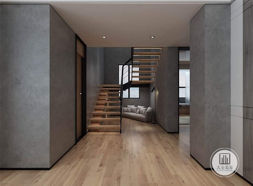 楼梯效果图：同样的灰色艺术墙面，黑色的边缘线条，楼梯采用了木质的镂空拼接楼梯，黑色的金属框架，楼梯挂角处摆放了一张浅灰色的布艺沙发。
